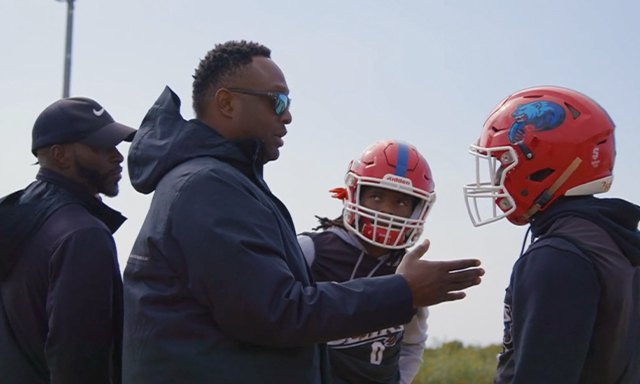 Josh Norman is seen coaching student athletes during the Coaching Against the Odds segment of Season 3, Show 3 of the Power of Sports.